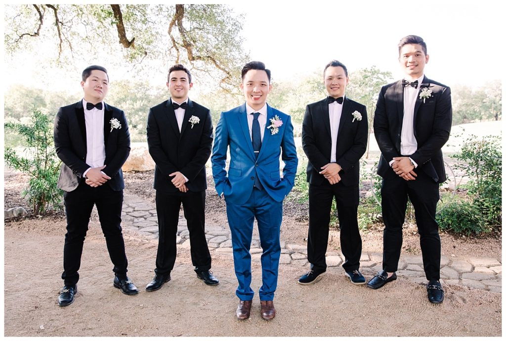 Groom in navy blue suit poses with his 4 groomsmen at Stonebridge photographed by Picture Bouquet Studio. 