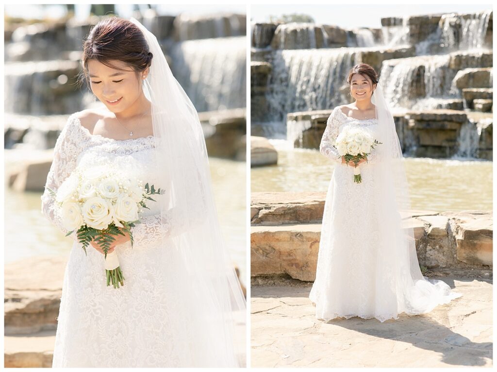 Close up portrait shot of bride in off shoulder long sleeve lace wedding dress and long veil with white bouquet on left and full body shot of bride on right in front of rock waterfall during bridal party portraits at Flower Mound River Walk photographed by Dallas wedding photographer, Jenny Bui of Picture Bouquet Studio. 