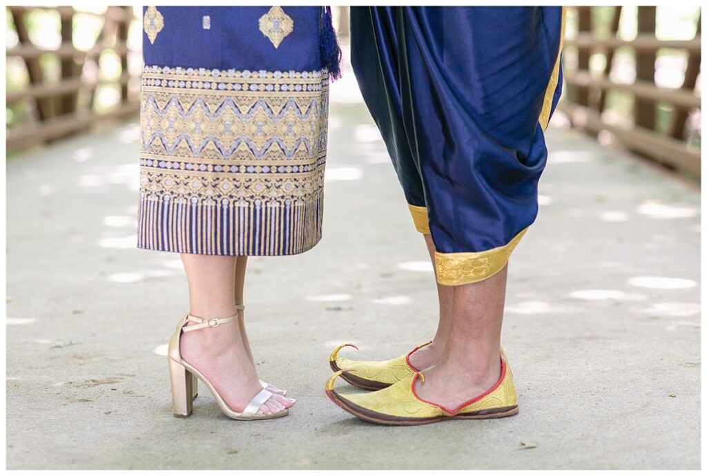 Close of bride's gold heels and groom's traditional shoes for Laotian wedding portrait session at North Richland HIll's park for Jenny Bui of Picture Bouquet Studio, a wedding photography studio serving the Dallas and surrounding areas. 