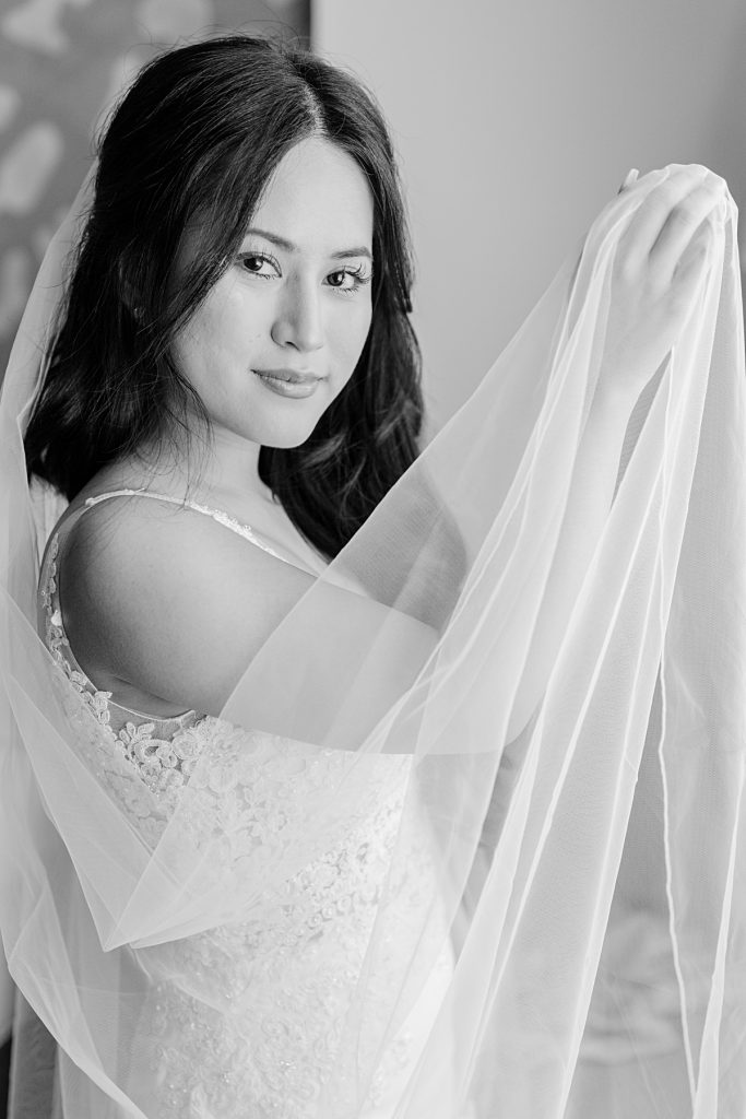 Gorgeous black and white photograph of Asian bride photographed by Dallas Vietnamese wedding photographer Jenny Bui of Picture Bouquet Studio. 