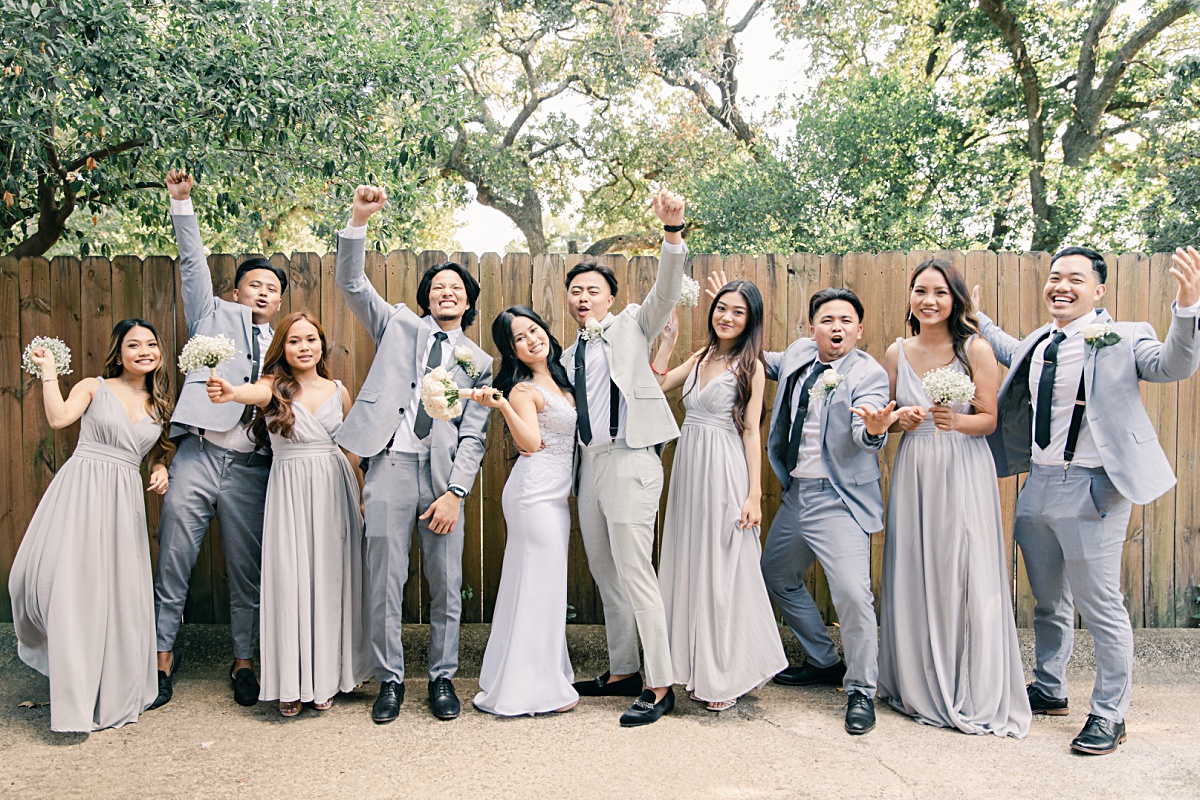 Bridal party cheering at Chin Revival Church photographed by Picture Bouquet Studio.