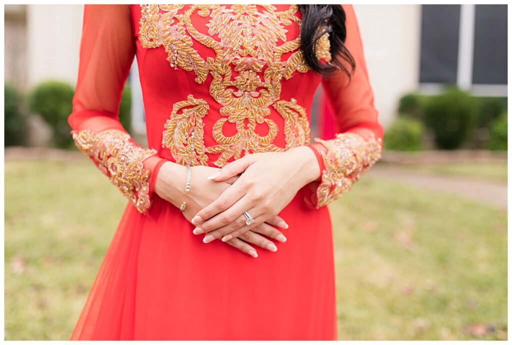 Close up of beautiful beading on red ao dai worn by bride during Dallas Vietnamese tea ceremony photographed by Picture Bouquet Studio. 