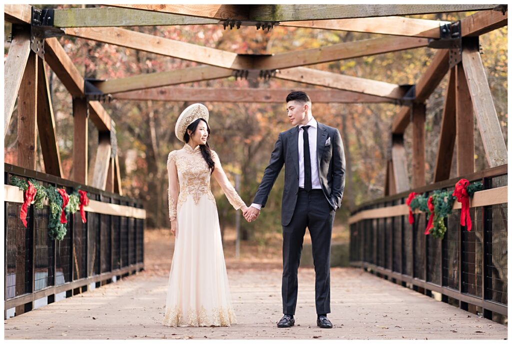 Vietnamese bride in gorgeous yellow ao dai gazing at groom in grey suit at Prairie Creek park photographed by Jenny Bui of Picture Bouquet Studio. 