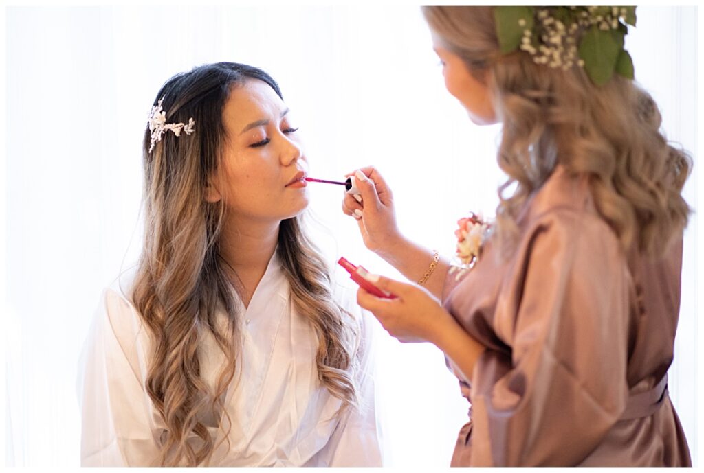Bride getting ready for The Pearl wedding in Arlington, TX photographed by Picture Bouquet Studio. 