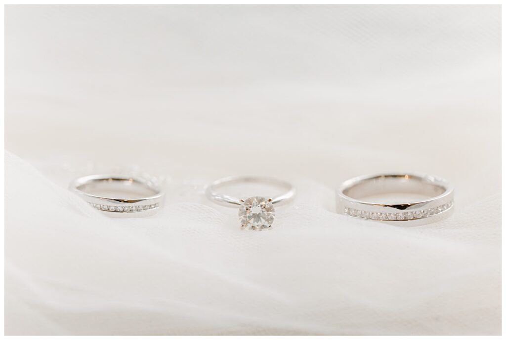 Detail shot of wedding band and engagement rings photographed by Dallas wedding photographer Picture Bouquet Studio. 
