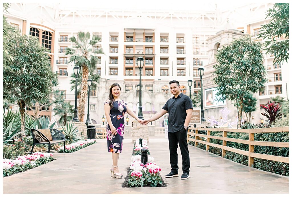 Engaged couple holding hands at Gaylord Texan Resort for engagement session photographed by Picture Bouquet Studio. 