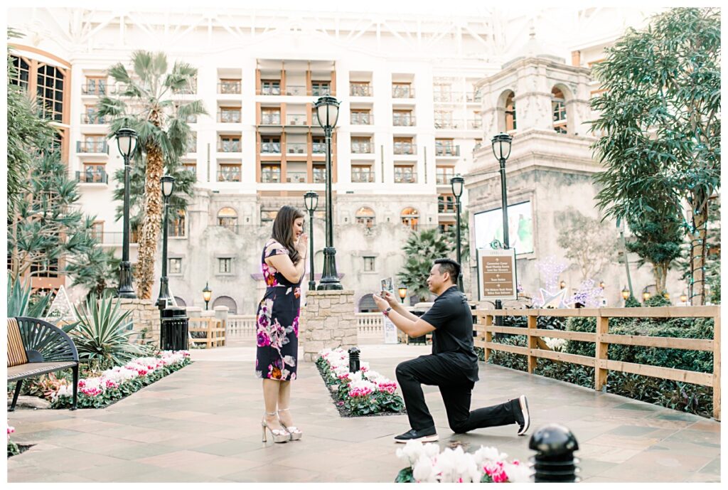 Guy proposes to girl at Gaylord Texan Resort and Convention center photographed by Picture Bouquet Studio. 