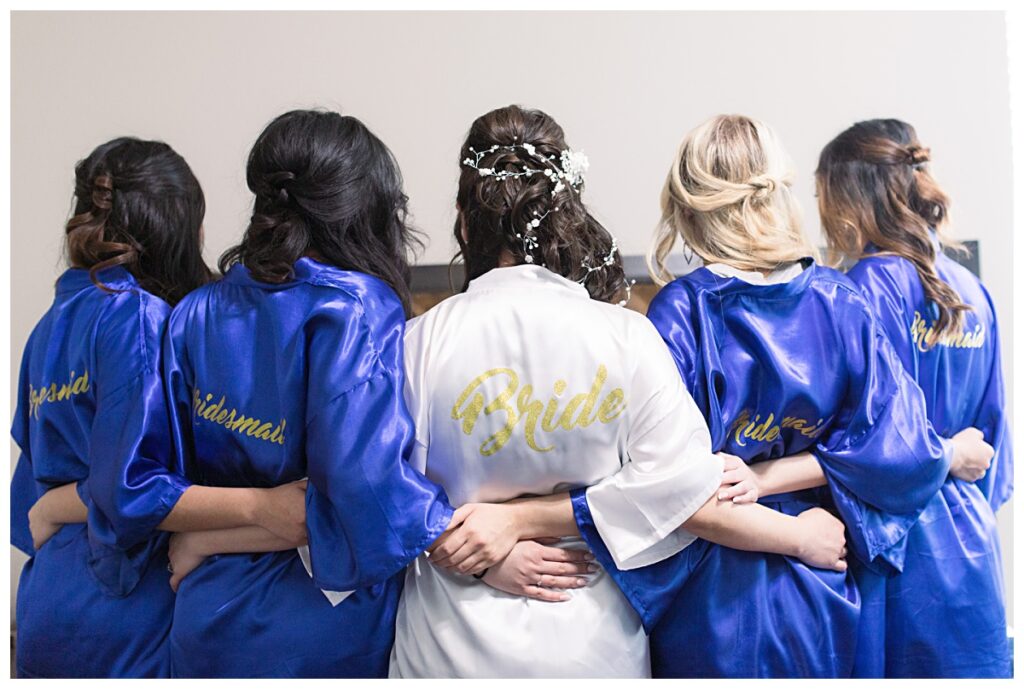 Detail shot of bride and bridesmaid wording on back of robe for Dallas Vietnamese wedding photographed by Jenny Bui of Picture Bouquet Studio.  