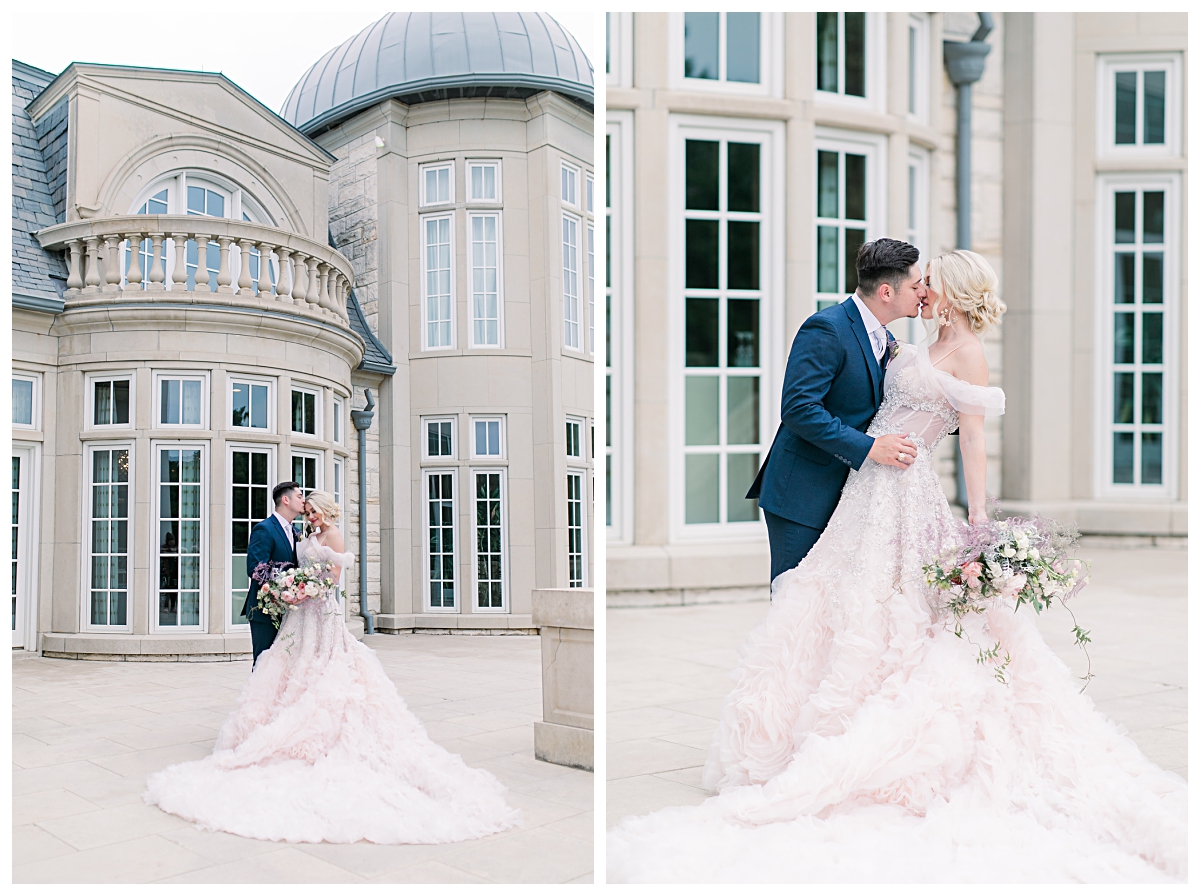 Groom in navy suit kissing bride in blush wedding gown at The Olana wedding venue photographed by Dallas Wedding photographer Jenny Bui of Picture Bouquet Studio. 