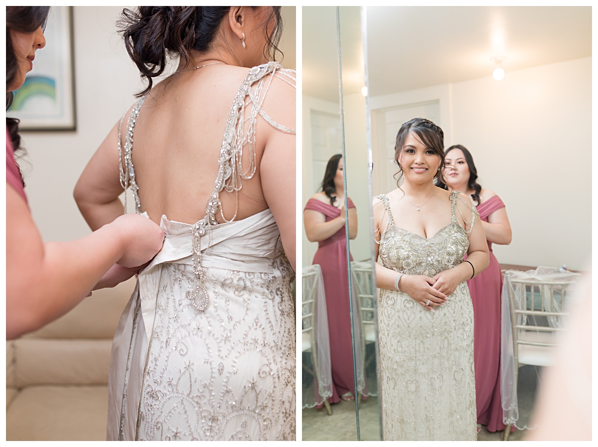 Maid of honor in dusty rose dress zipping up bride photographed by Dallas wedding photographer Jenny Bui of Picture Bouquet Studio. 