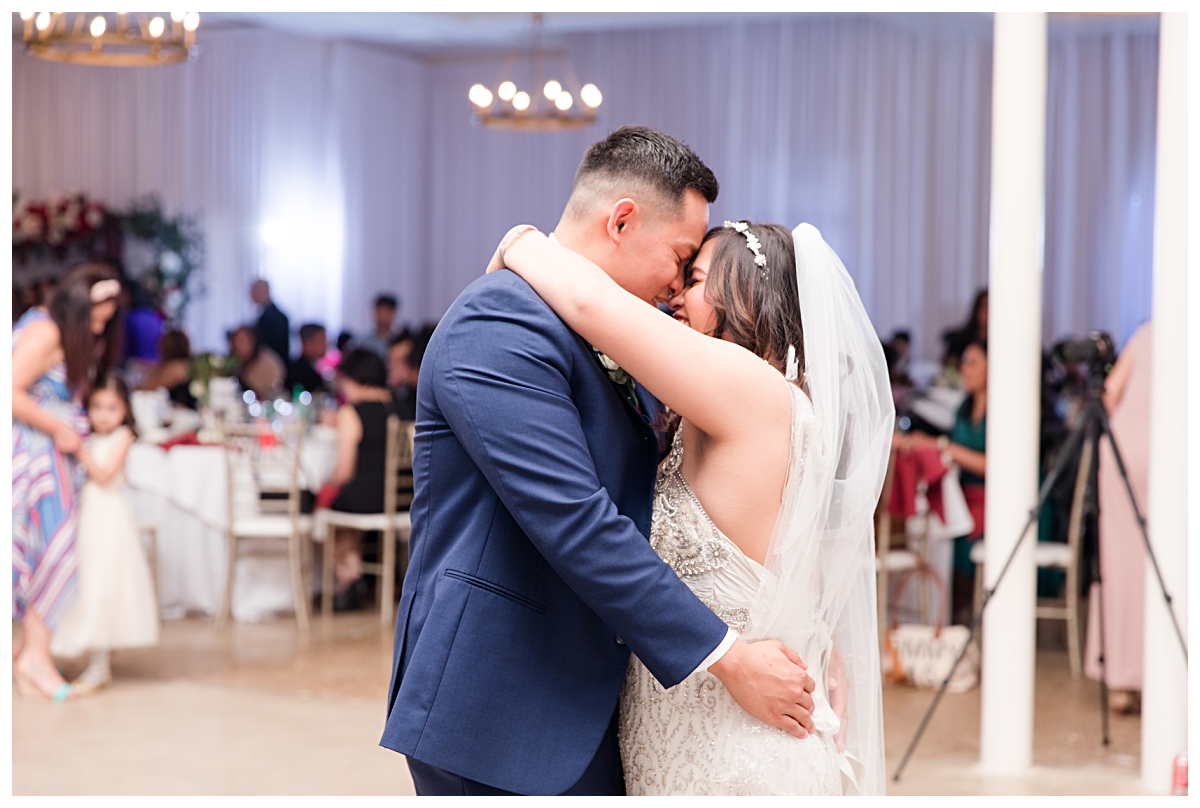 Bride and groom dancing during Dallas Vietnamese wedding at Zander House photographed by Dallas wedding photographer Jenny Bui of Picture Bouquet Studio. 