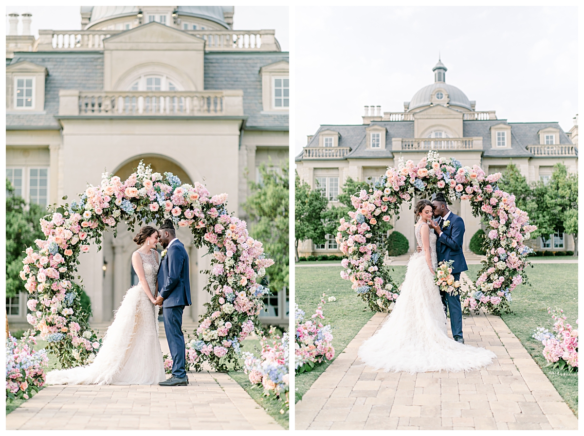 Bride and groom in front of circle pastel colored floral arch in front of  The Olana Wedding venue for styled shoot photographed by Dallas Wedding Photographer Jenny Bui of Picture Bouquet Studio. 