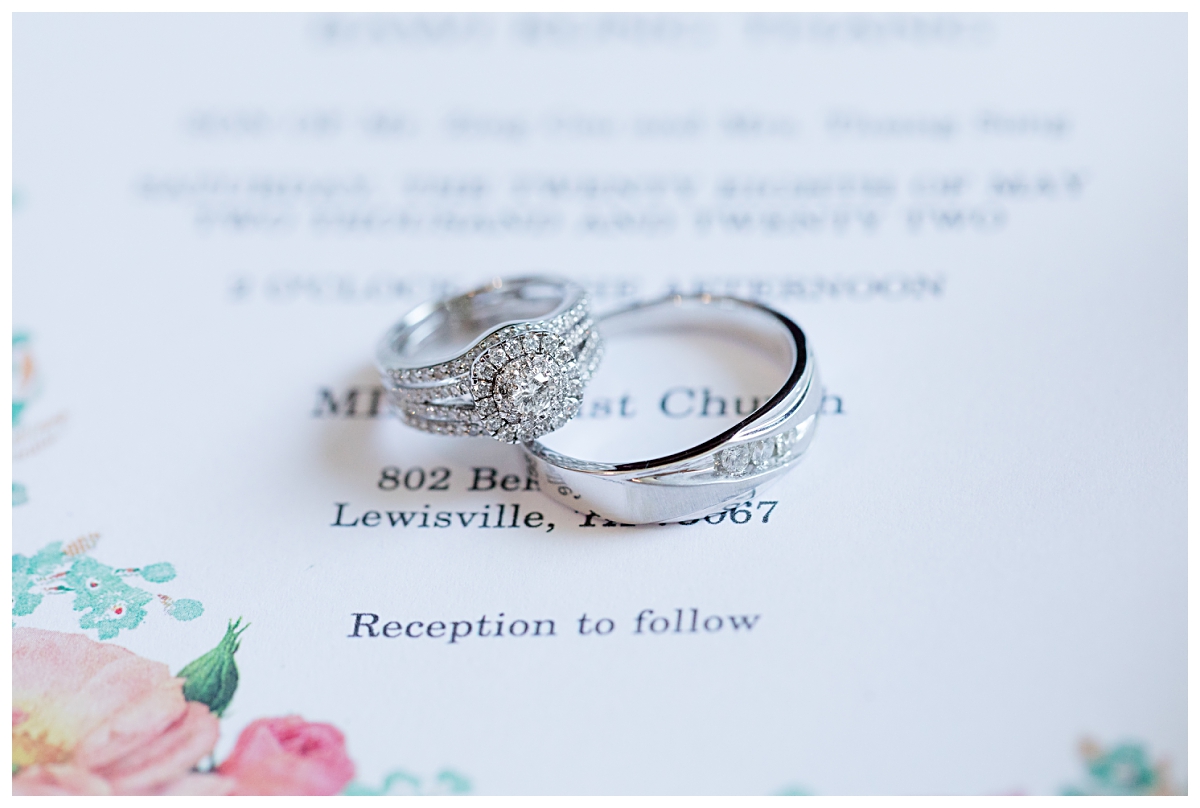 Ring shot of gorgeous engagement ring and wedding bands from Lewisville Texas wedding photographed by Dallas wedding photographer Jenny Bui of Picture Bouquet Studio. 