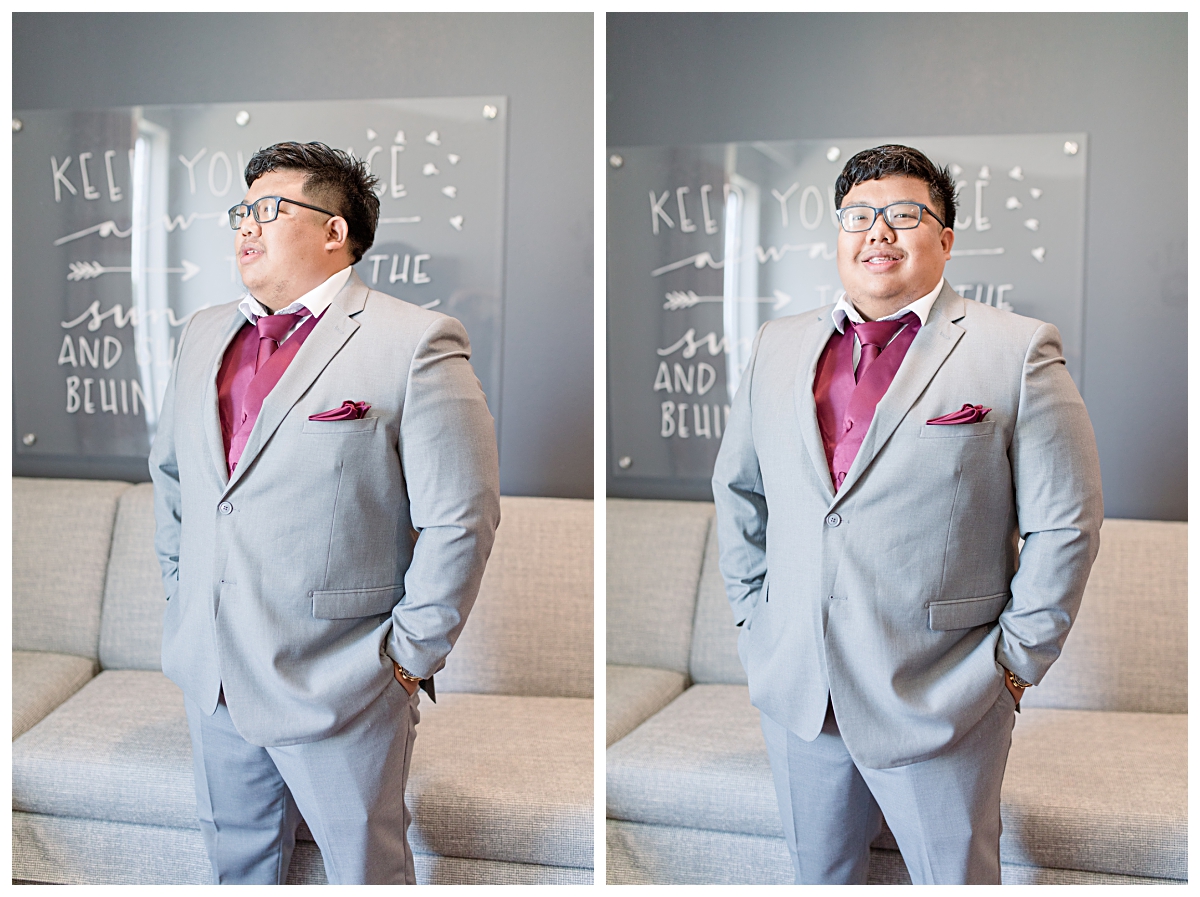Texas groom in burgundy vest and tie poses for portraits during getting ready portion of wedding day photographed by Dallas wedding photographer Jenny Bui of Picture Bouquet Studio. 