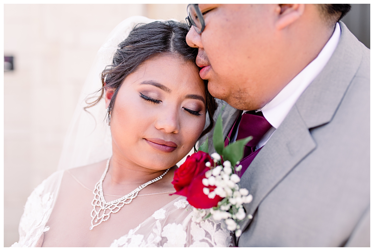 Close portrait of bride and groom embracing for wedding portraits at Flowermound Riverwalk photographed by Dallas wedding photographer Jenny Bui of Picture Bouquet Studio. 