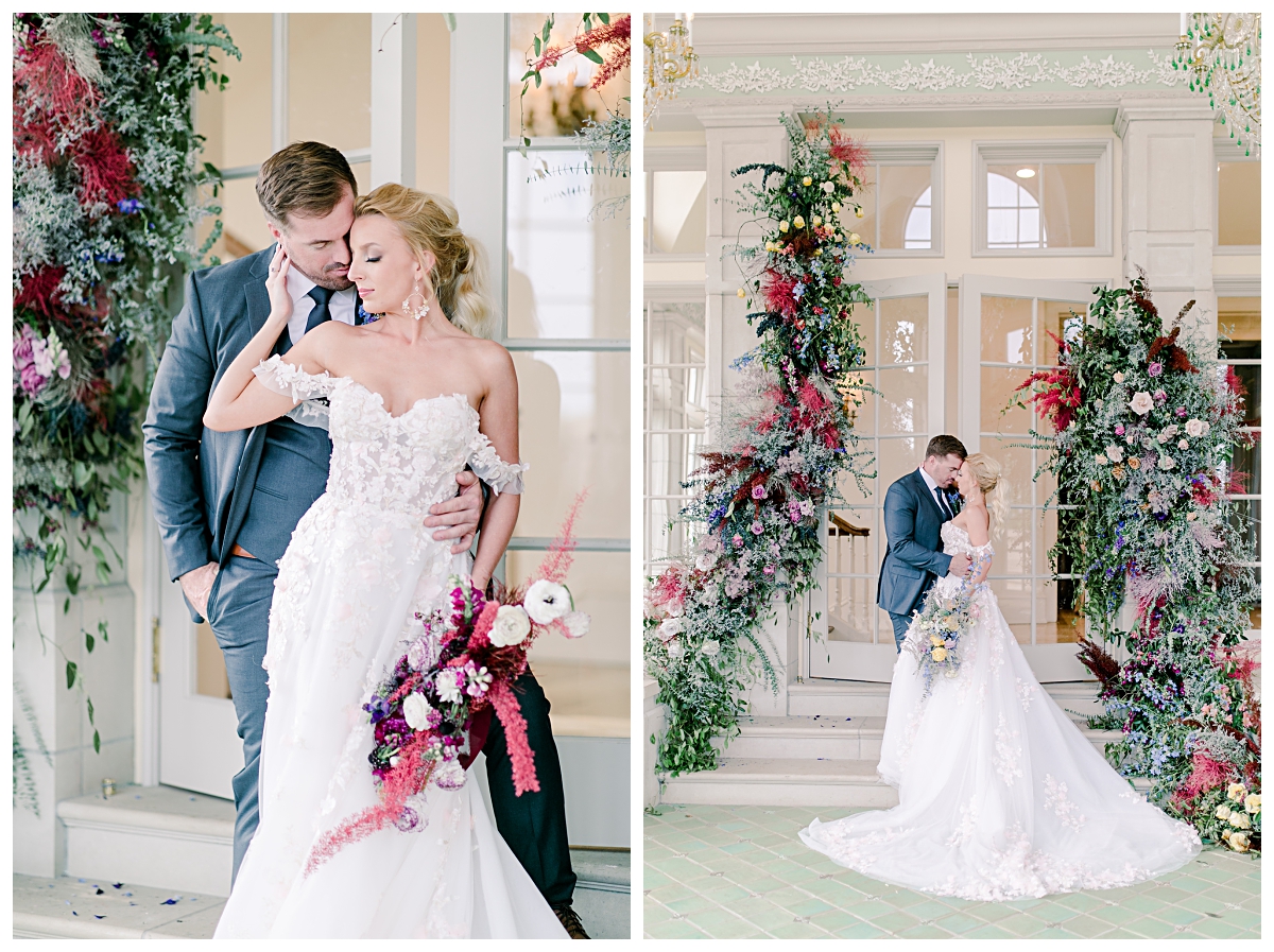 Bride in off shoulder white wedding dress presses against groom and hugging him on right in front of glass doorway at The Olana photographed by Dallas wedding photographer Jenny Bui of Picture Bouquet Studio. 