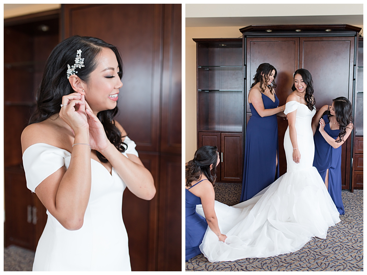 Bride putting on her wedding day earrings on left and bridesmaids in floor length royal blue bridesmaids dress helping bride finish up during getting ready photographed by Dallas wedding photographer Jenny Bui of Picture Bouquet Studio for Holy Trinity Catholic Church wedding in Dallas, TX.  