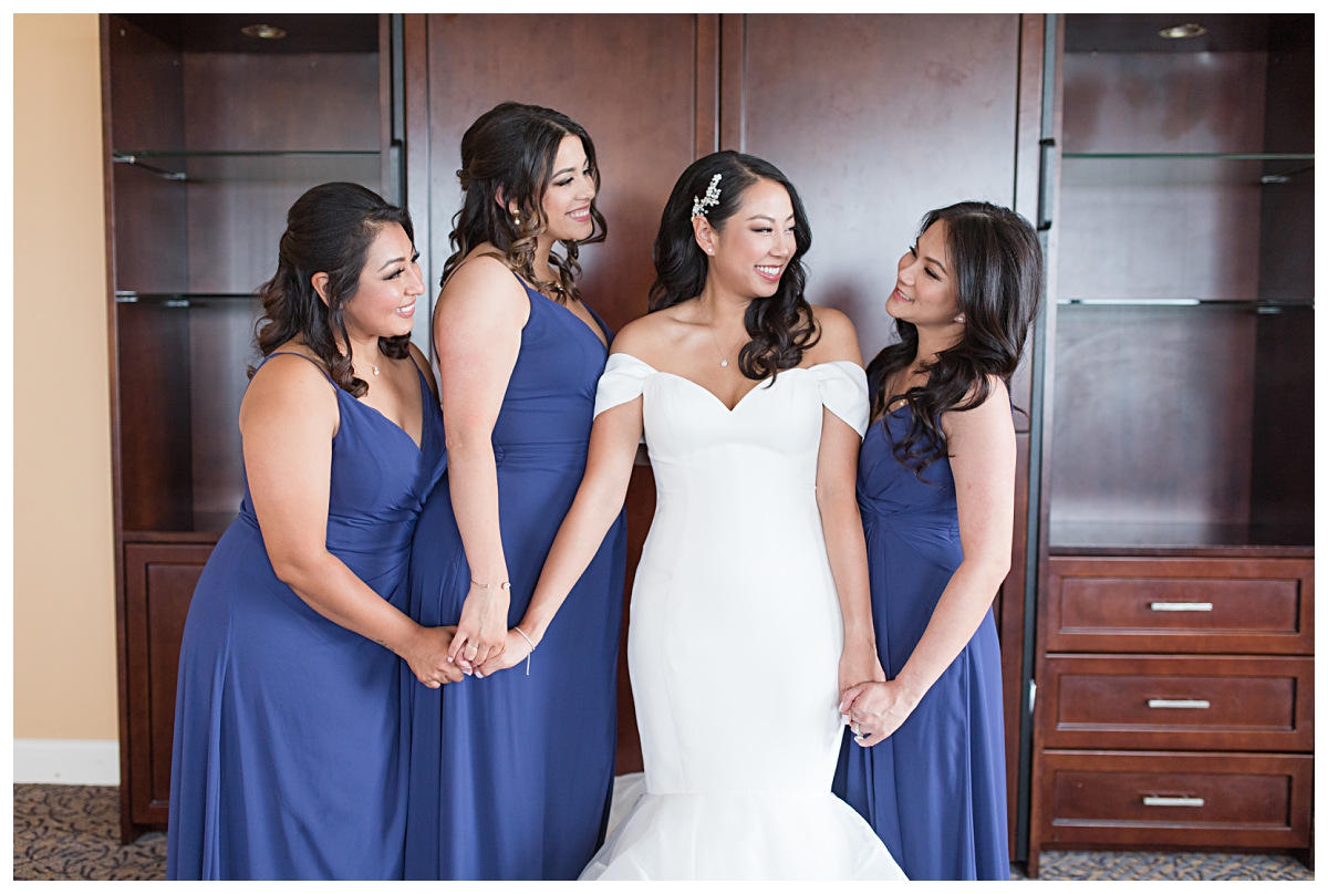 Gorgeous bridesmaids with beautiful Asian bride during getting ready portion of wedding day photographed by Dallas wedding photographer Jenny Bui of Picture Bouquet Studio for Holy Trinity Catholic Church wedding in Dallas, TX.  