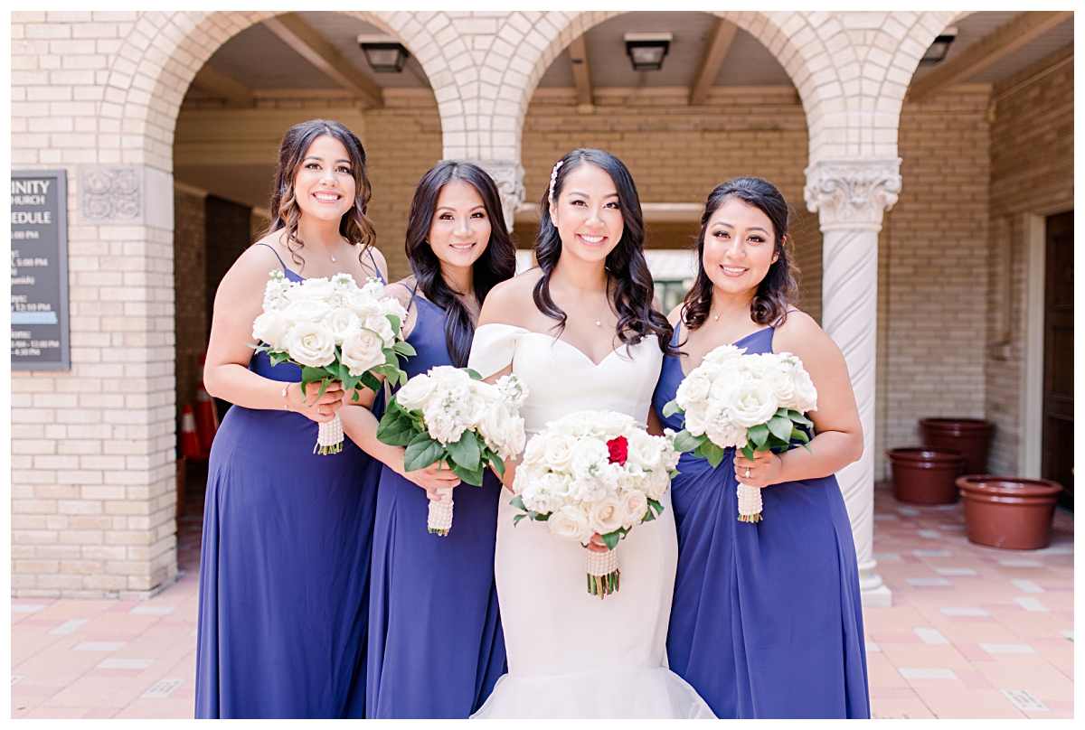 Gorgeous Asian bride and her bridesmaids in long royal blue bridesmaids dresses photographed by Dallas wedding photographer Jenny Bui of Picture Bouquet Studio for Holy Trinity Catholic Church wedding in Dallas, TX.  