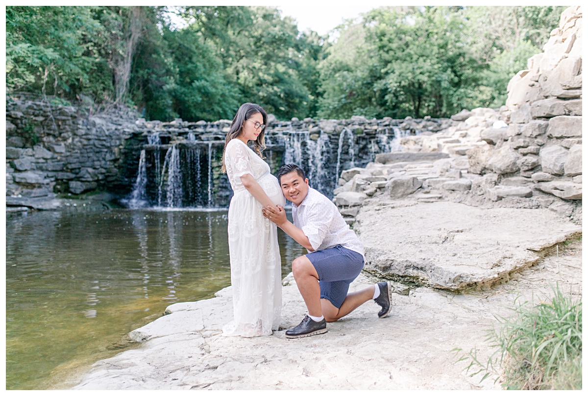 Husband listening to pregnant wife's bell during maternity session at Prairie Creek Park photographed by Dallas wedding and portrait photographer Jenny Bui of Picture Bouquet Studio. 