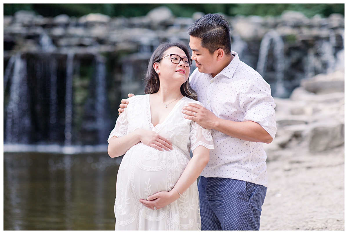Husband holding on to pregnant wife's shoulder's for Prairie Creek Maternity session photographed by Dallas wedding and portrait photographer Jenny Bui of Picture Bouquet Studio. 