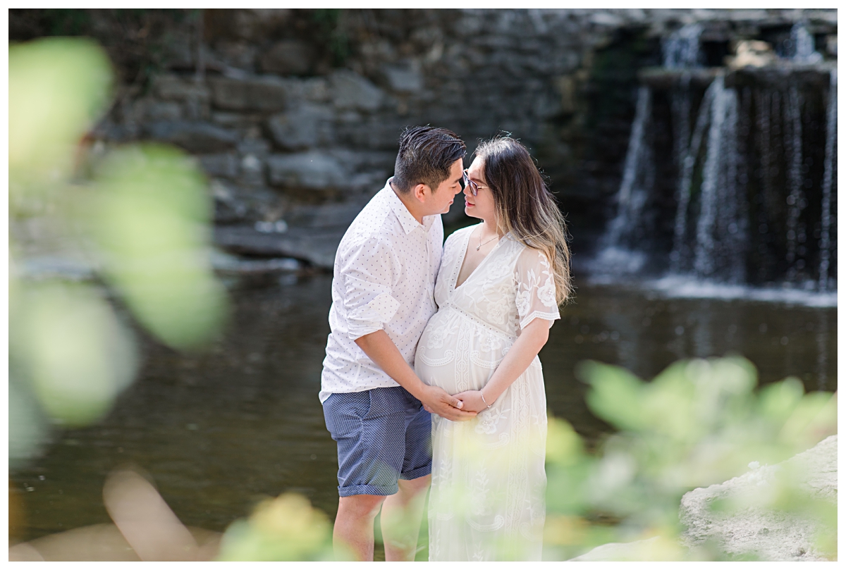 Husband and pregnant wife leaning in and hugging for Prairie Creek Maternity session photographed by Dallas wedding and portrait photographer Jenny Bui of Picture Bouquet Studio. 